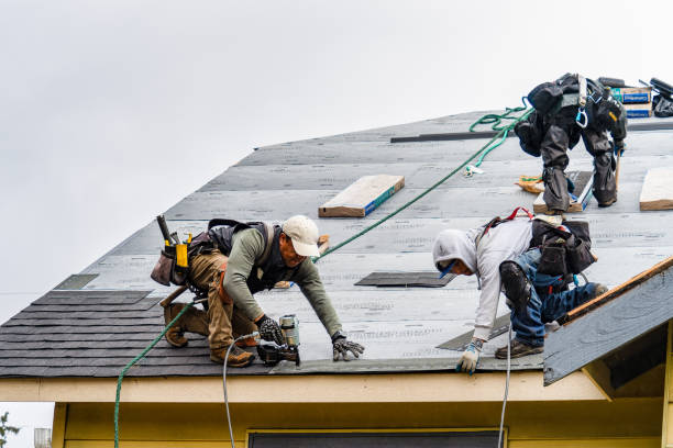 Professional Gutter Installation technician working in Devens, MA